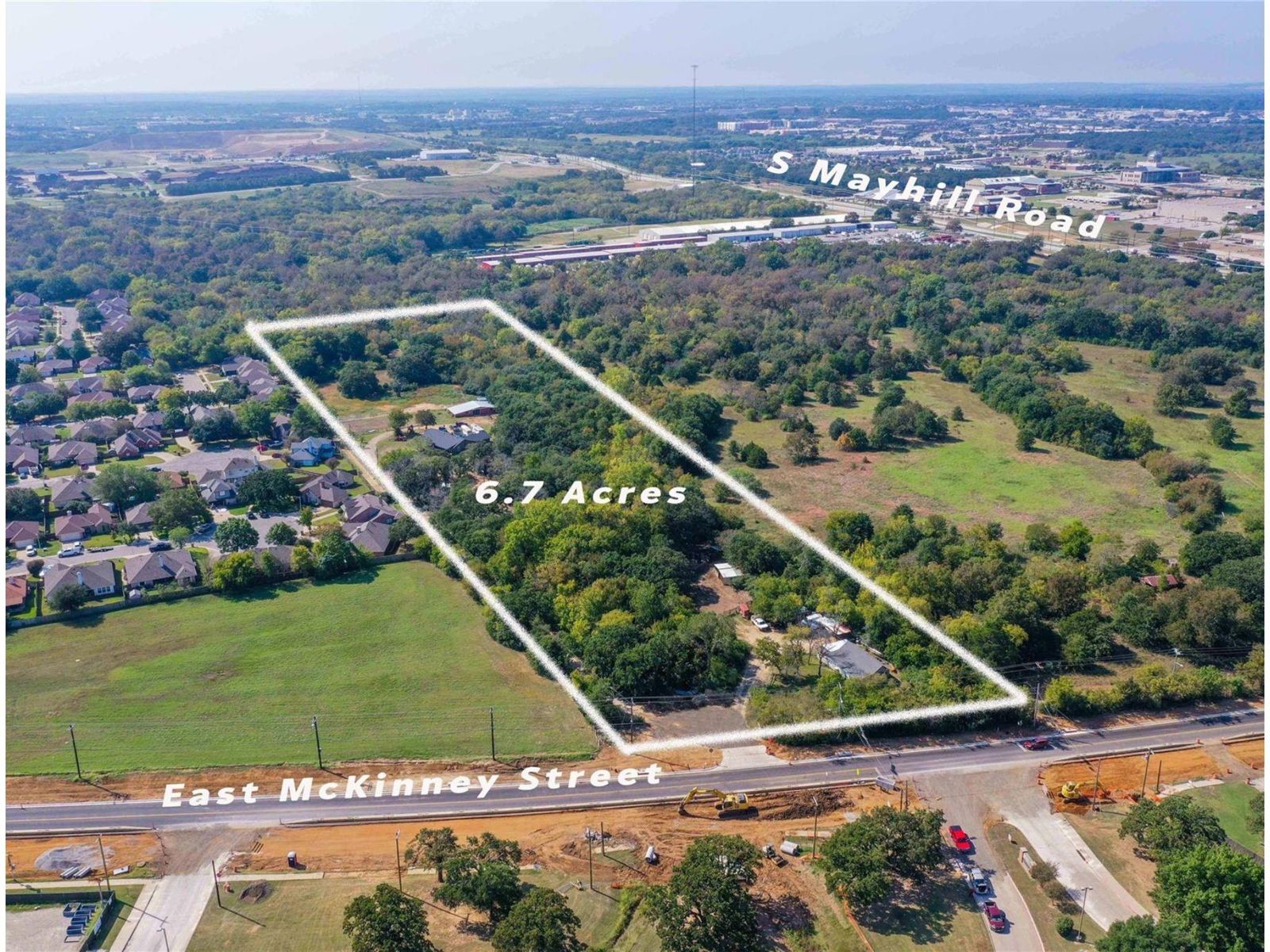 Aerial view of the 6.7 acres outlined, between East McKinney Street and S Mayhill Road